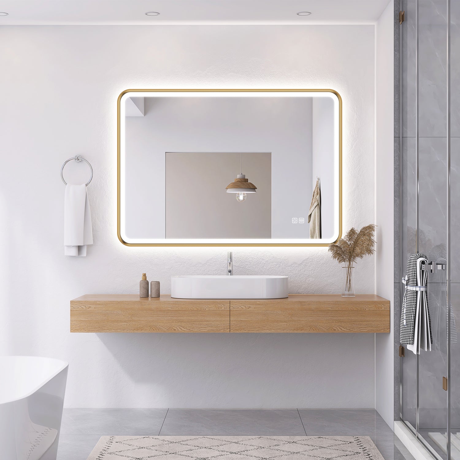 gold framed LED bathroom mirror installed above vanity in modern luxury bathroom setting